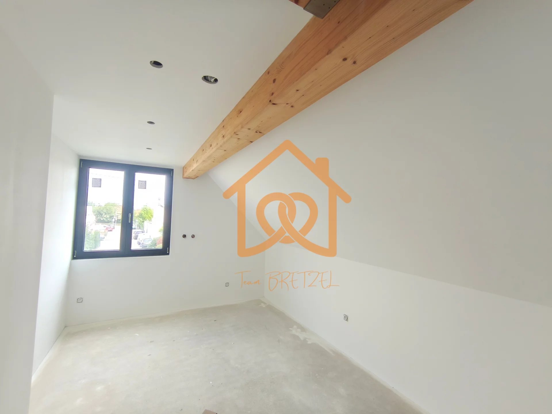 À Geispolsheim Village : Appartement avec garage, parking et un are de terrain - Premi'home Agence immobilière Aix En Provence